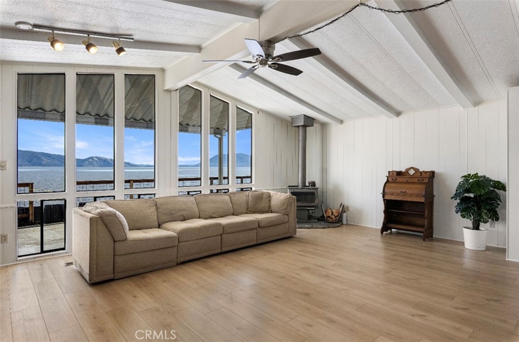 a living room with furniture ceiling fan and a rug