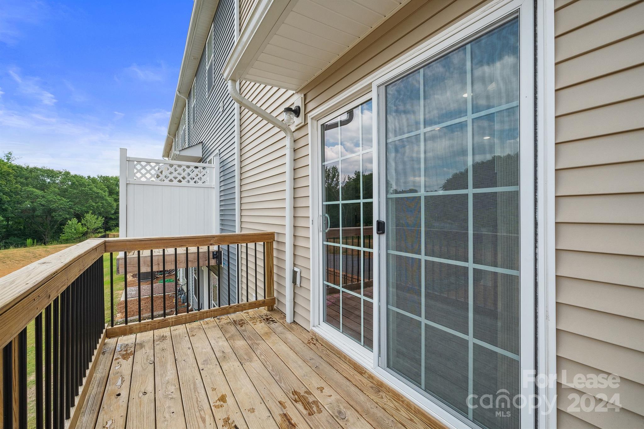 a view of balcony with wooden floor