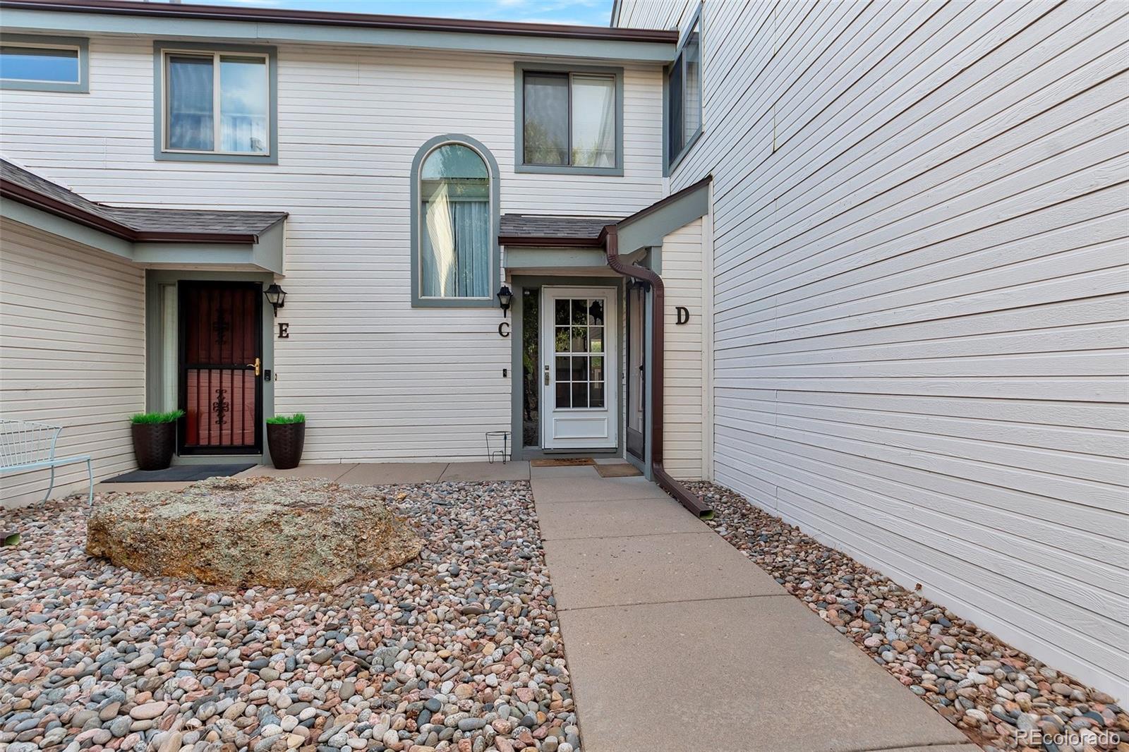 a view of a house with brick walls