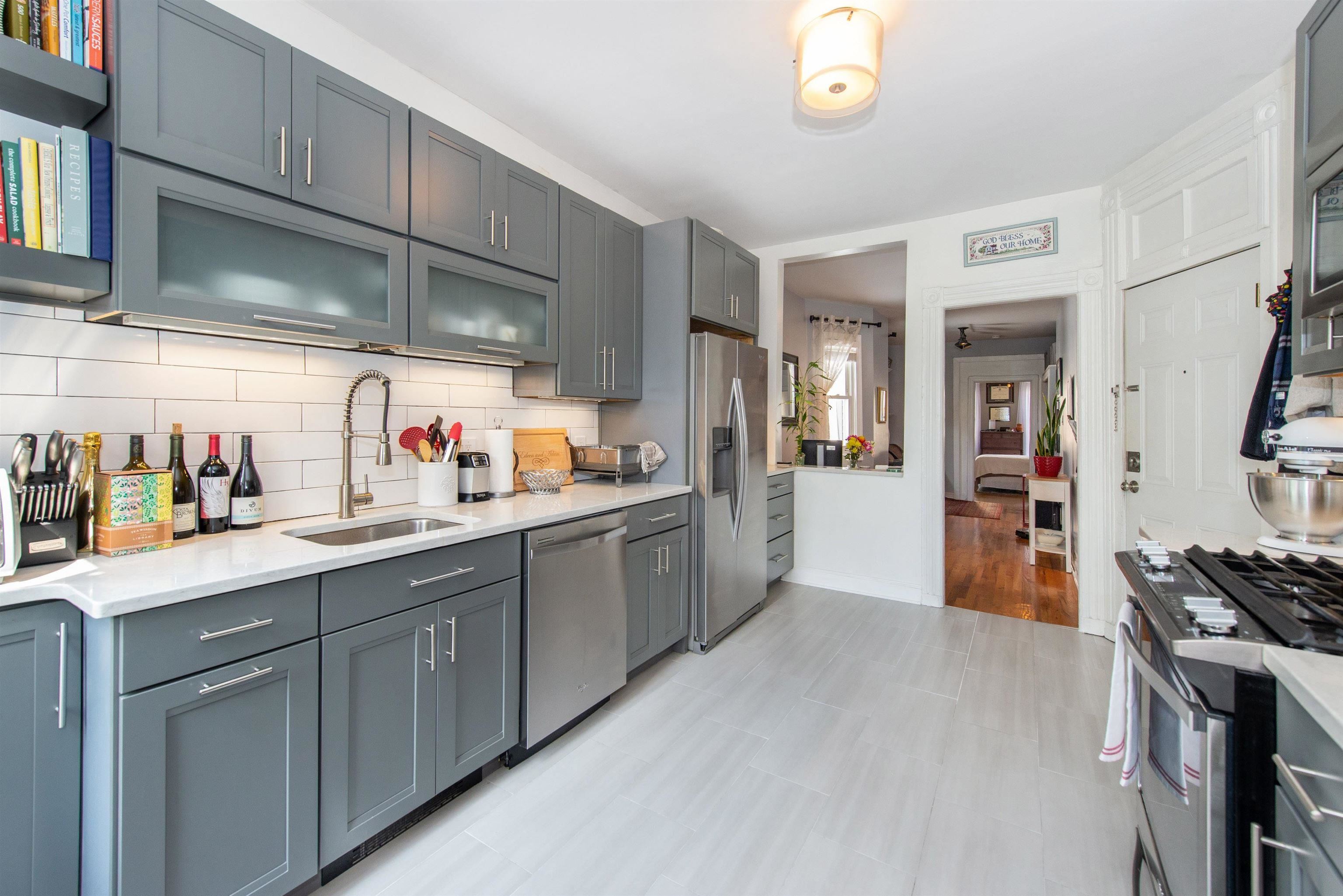 a kitchen with cabinets and window