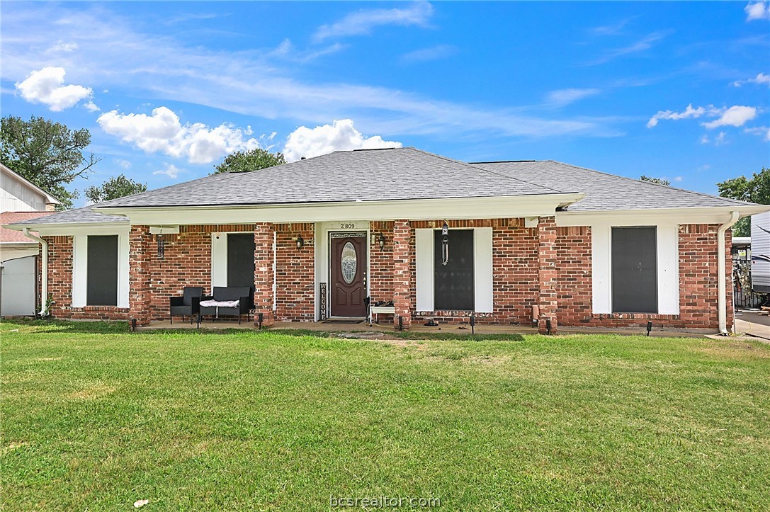 front view of a house with a yard