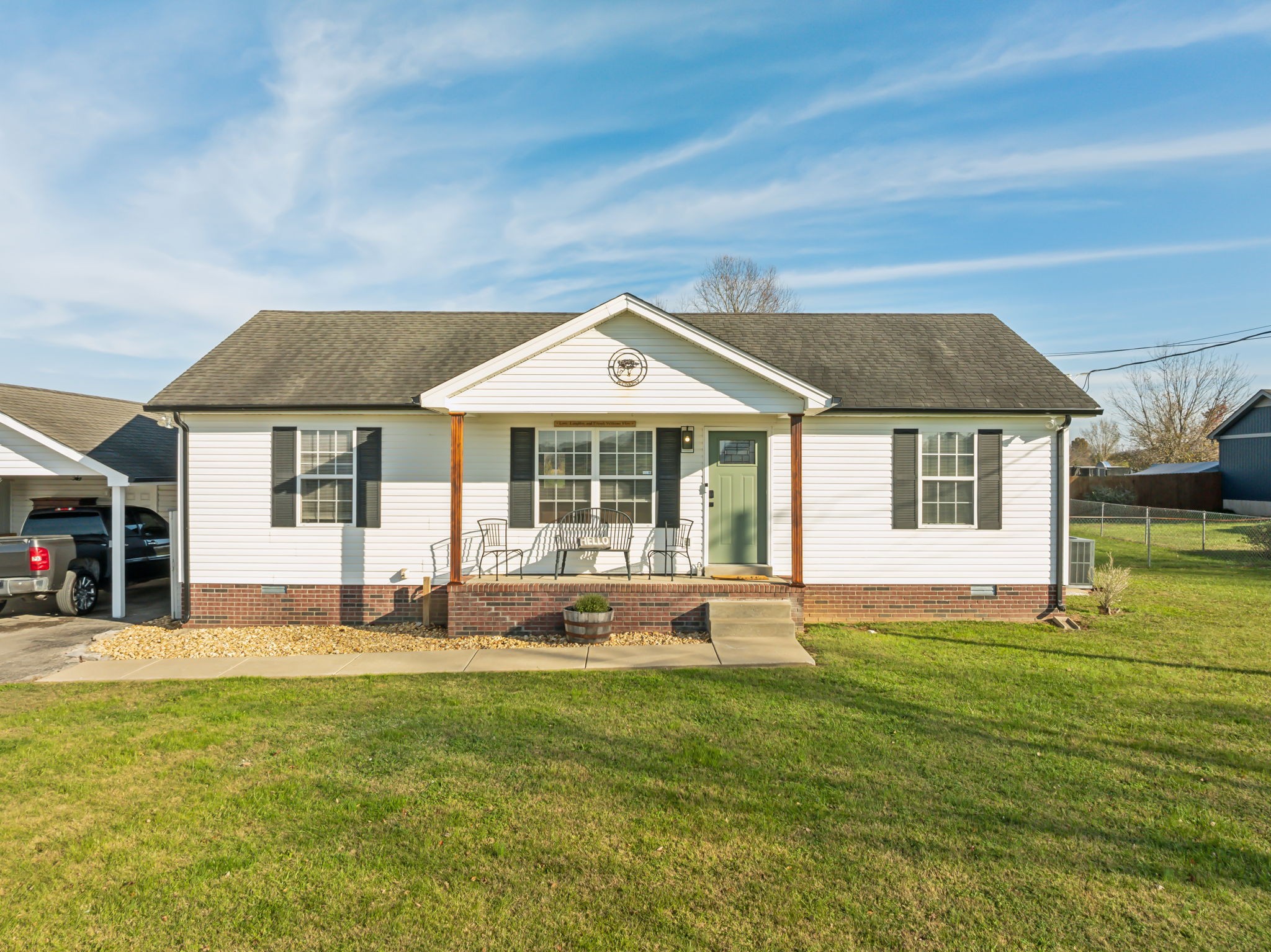 a front view of a house with a yard