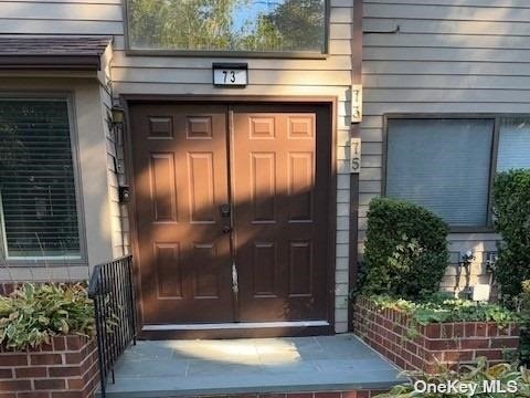 a front view of a house with a glass door