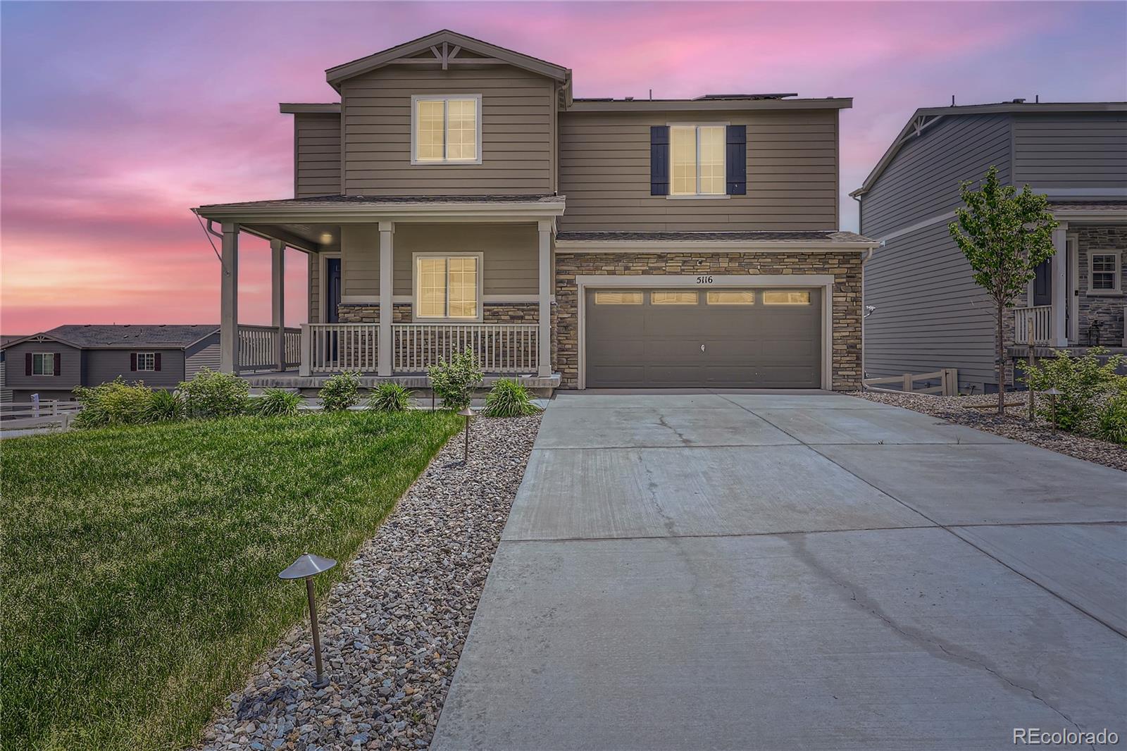 a front view of a house with yard