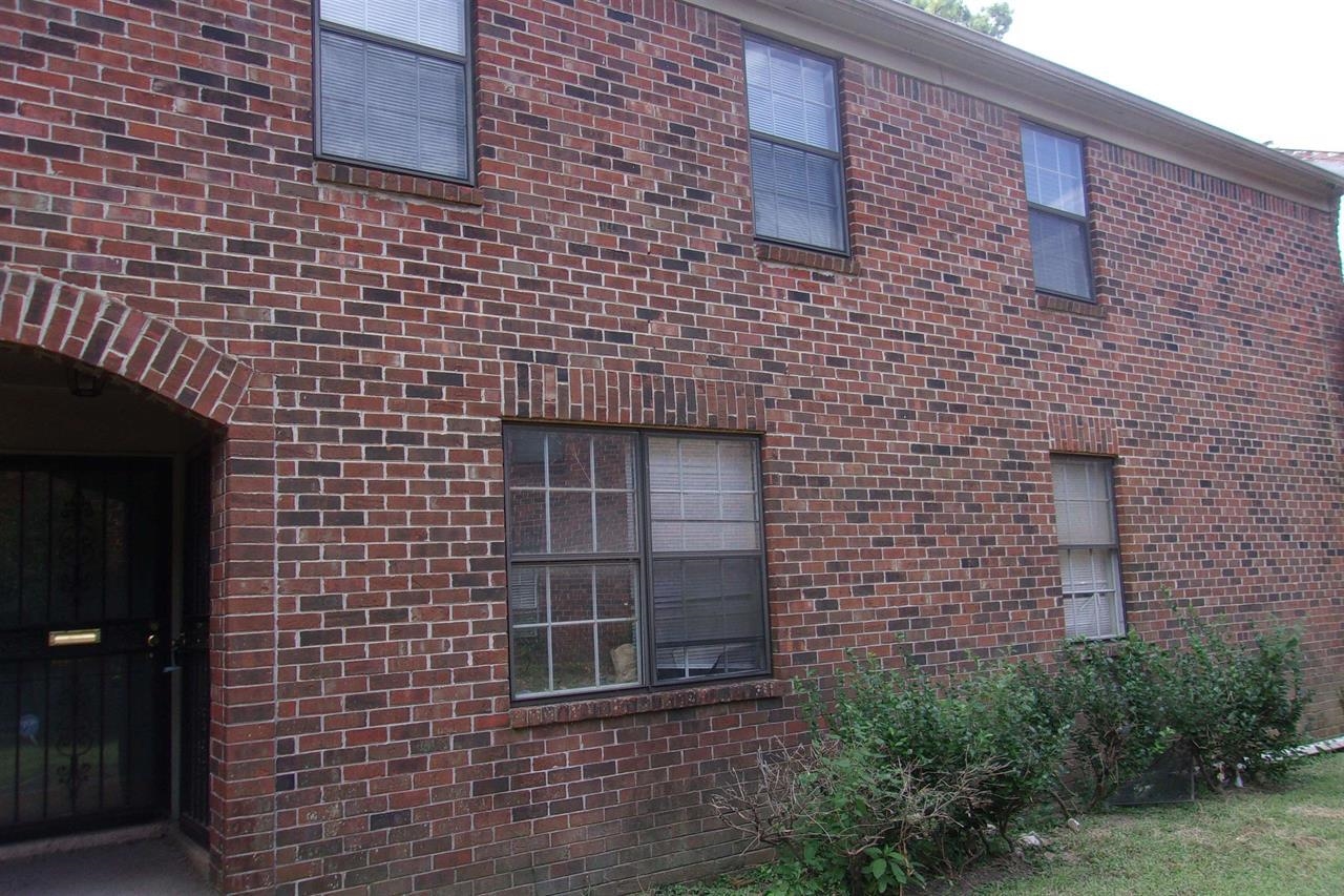 a brick building with a shower