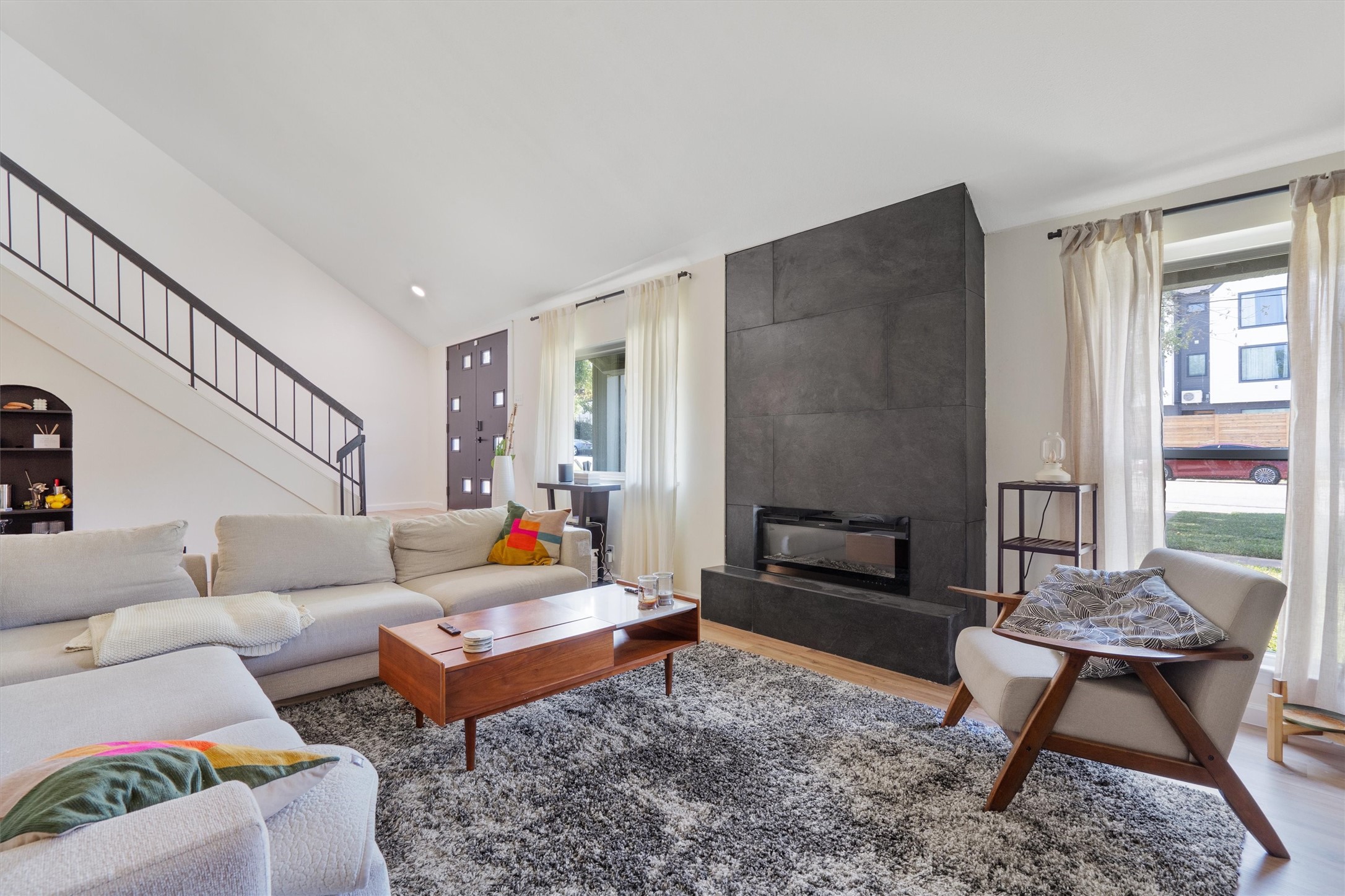 a living room with furniture and a fireplace