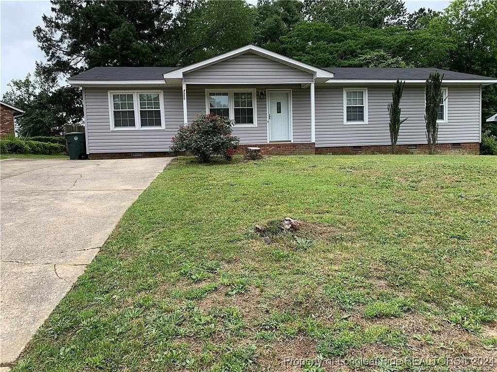 front view of a house with a yard