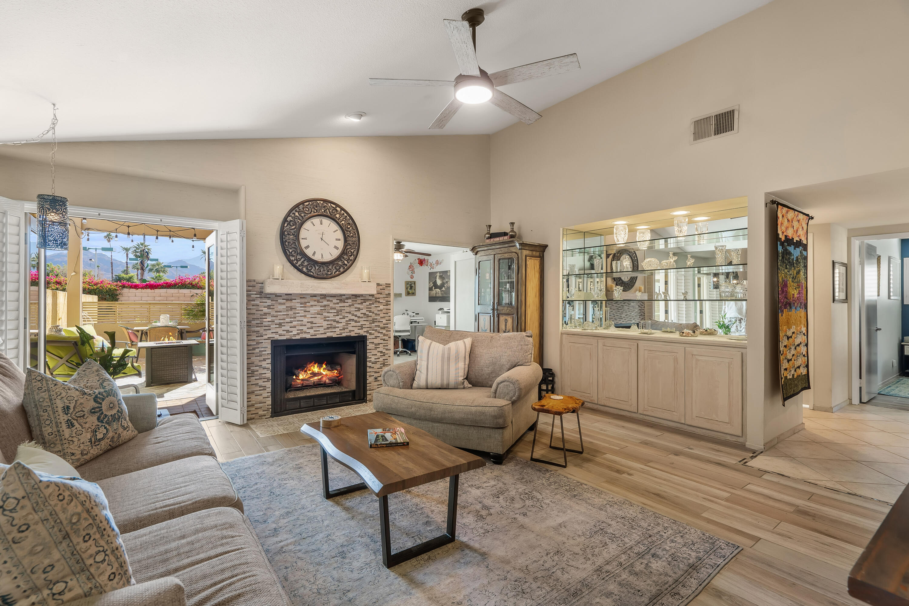 a living room with furniture and a fireplace