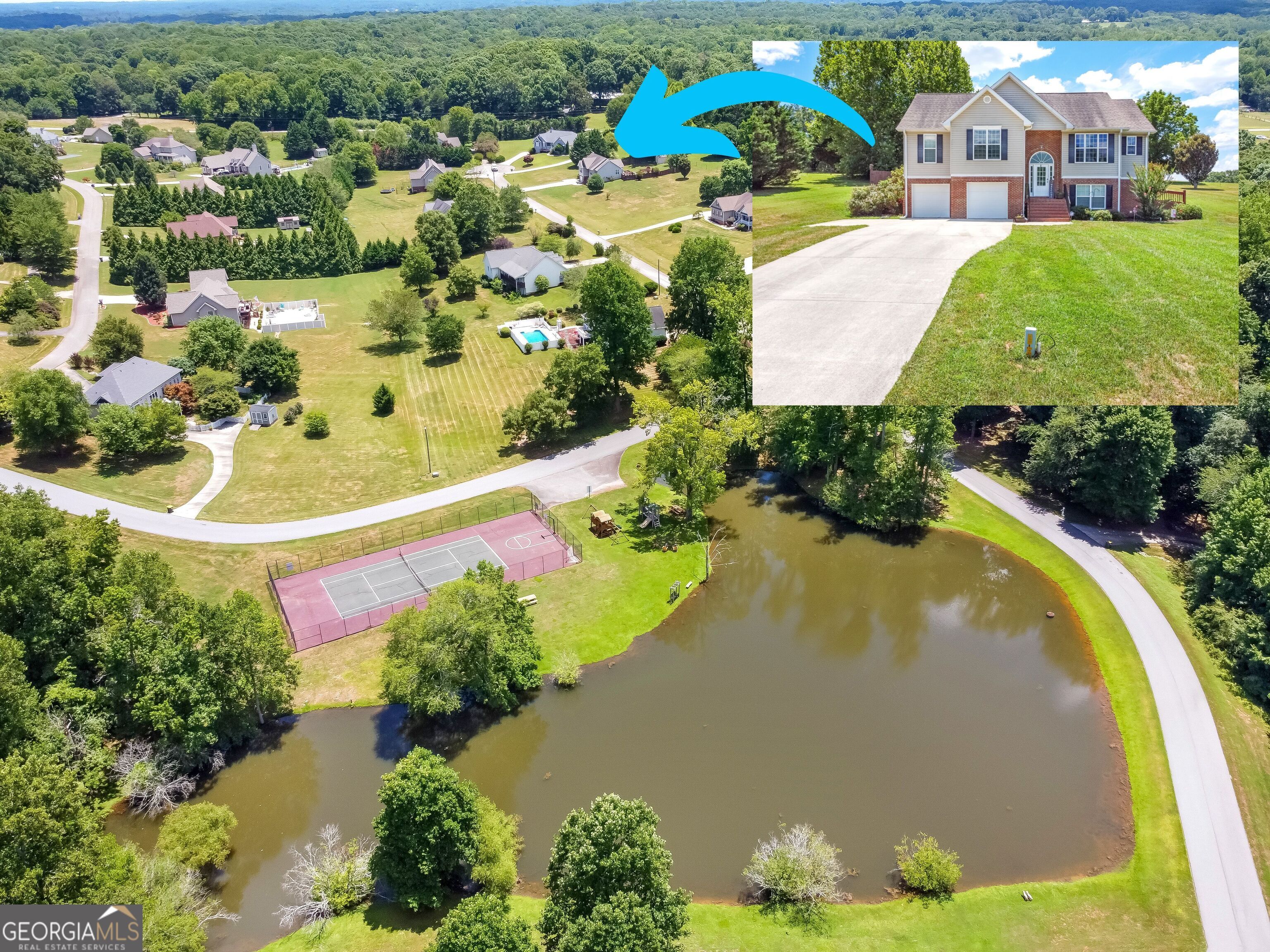 an aerial view of residential house with outdoor space and swimming pool