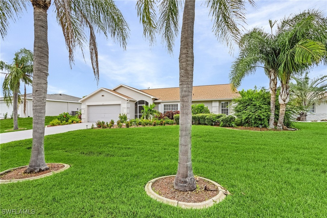 a front view of a house with a yard