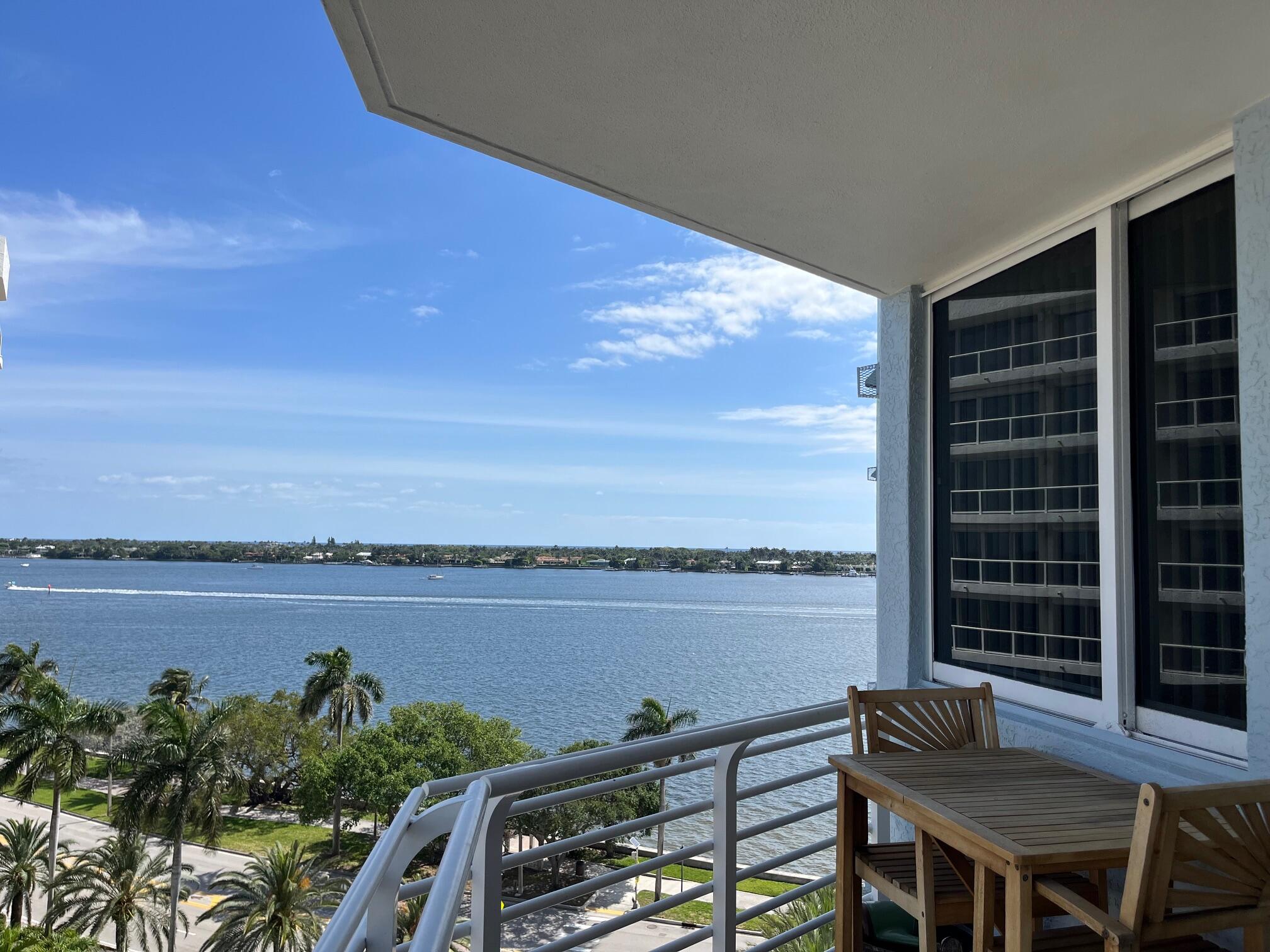 a view of a balcony with lake view and city view