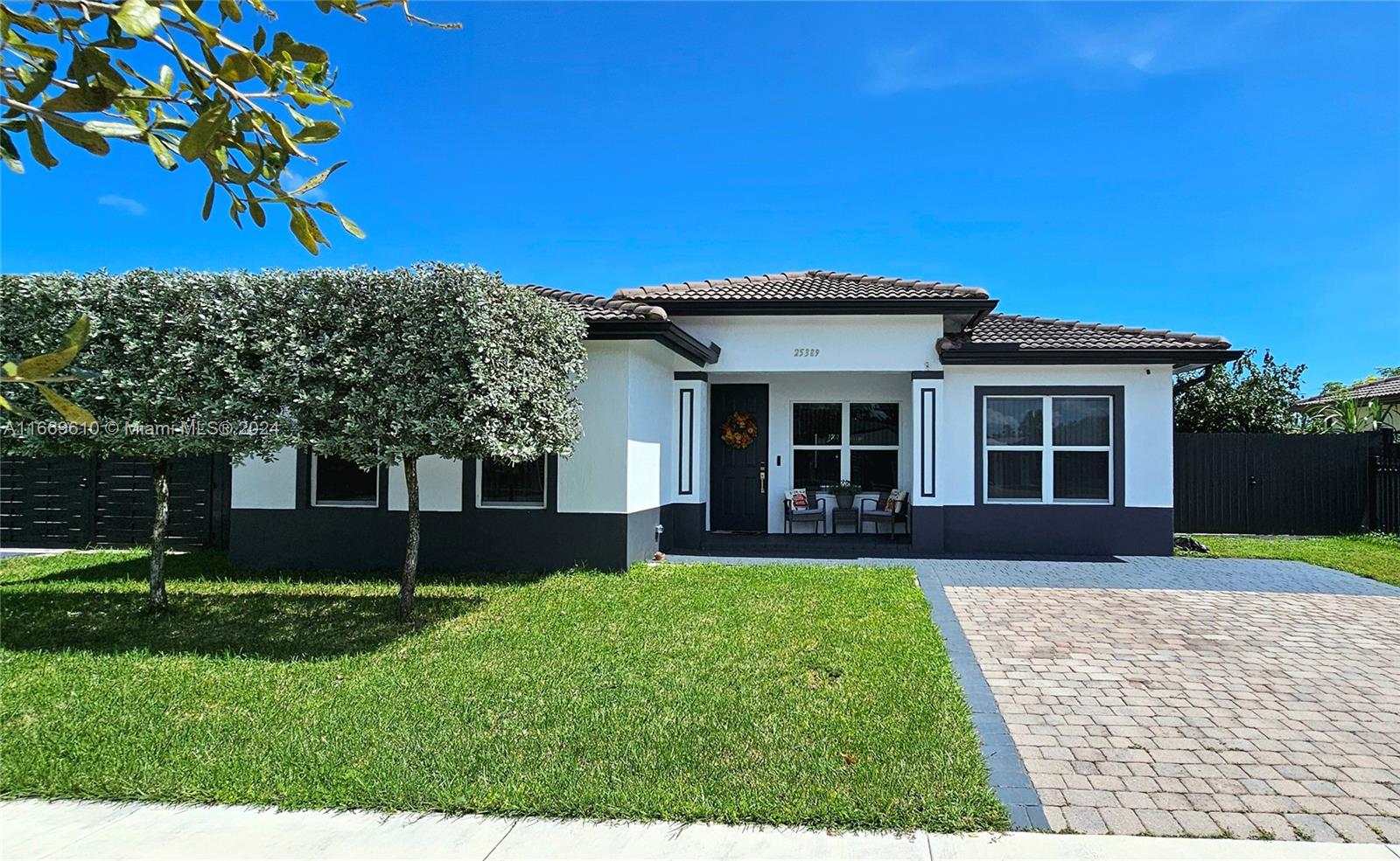 a front view of a house with a yard