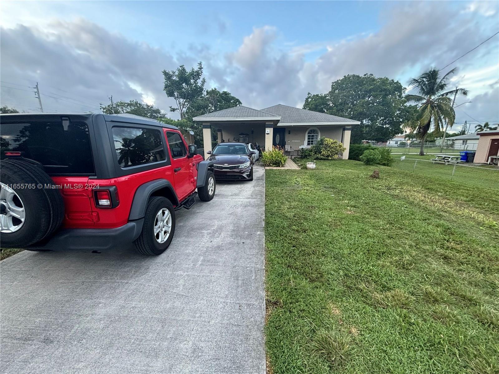 a view of a car in a yard