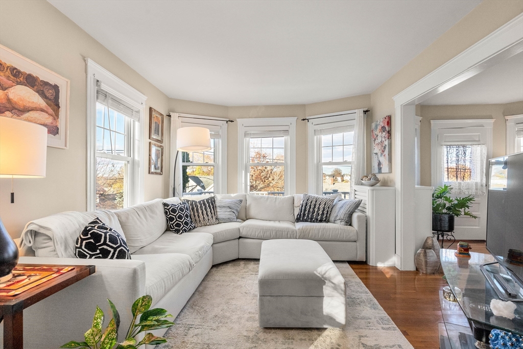 a living room with furniture and windows