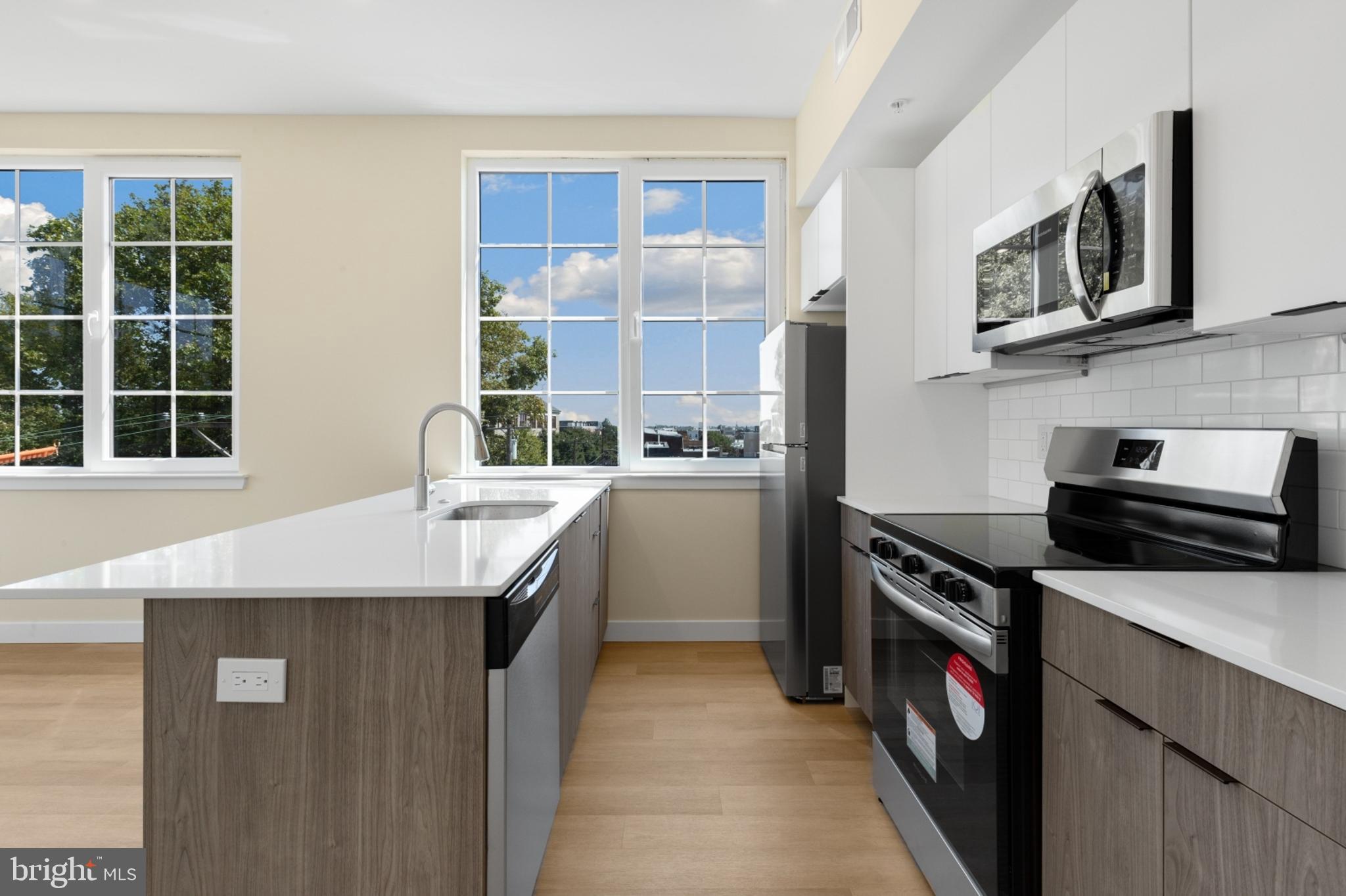 a kitchen that has a sink and a stove