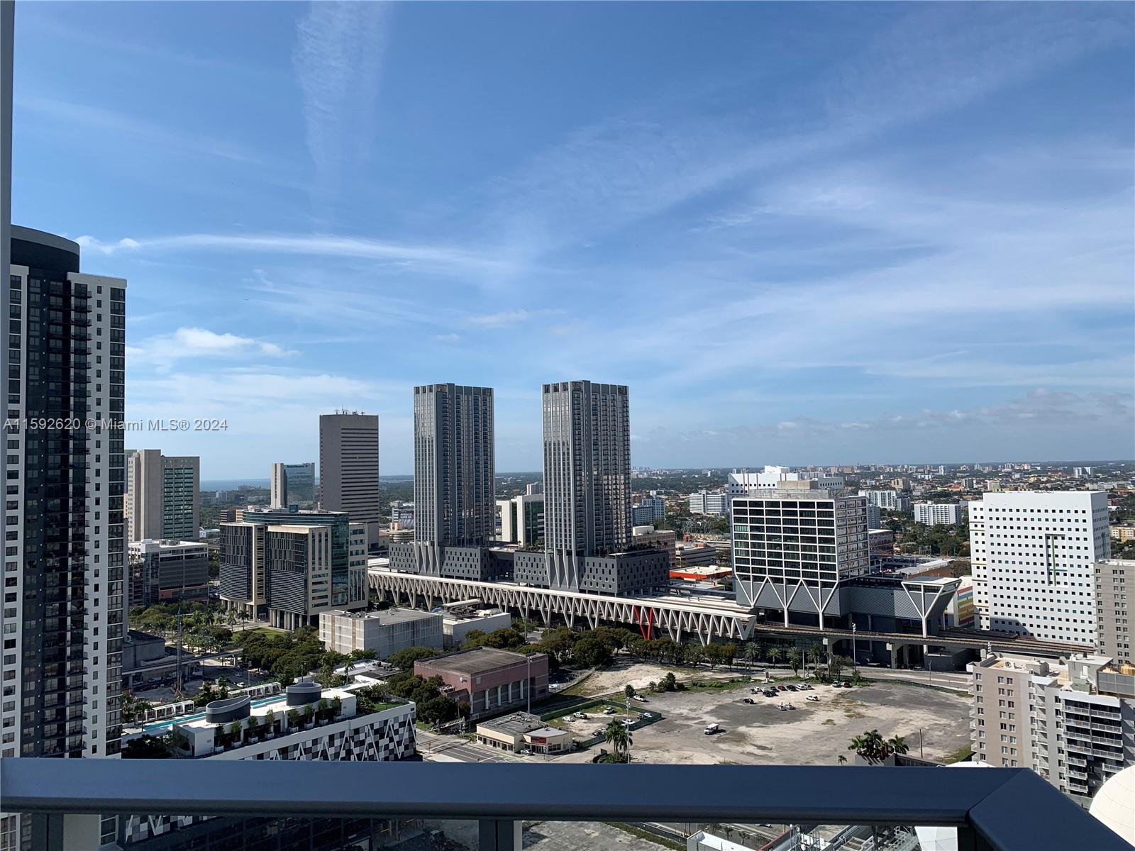 a view of a city with tall buildings