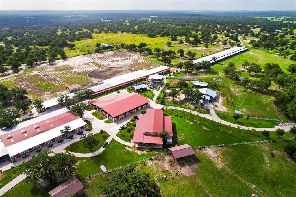 an aerial view of residential houses with outdoor space and river