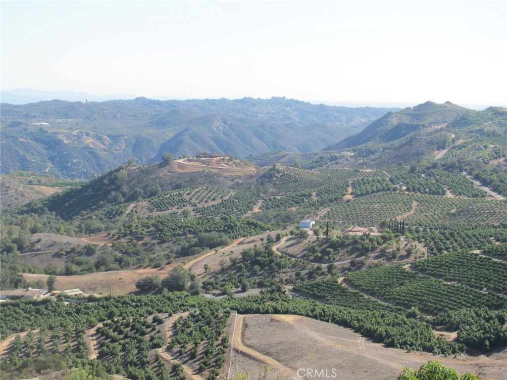 an aerial view of mountain with yard