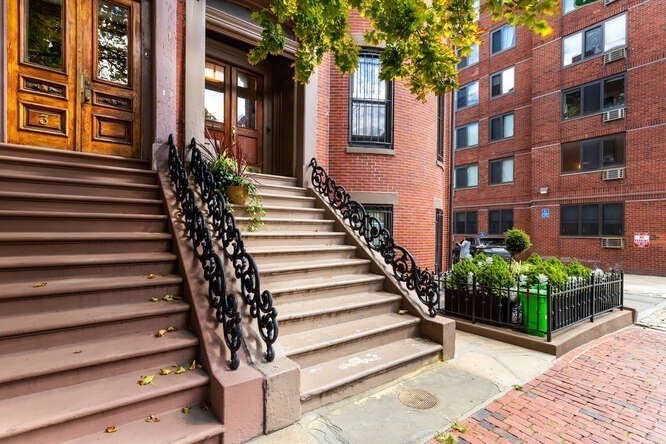 a view of a building with stairs and plants