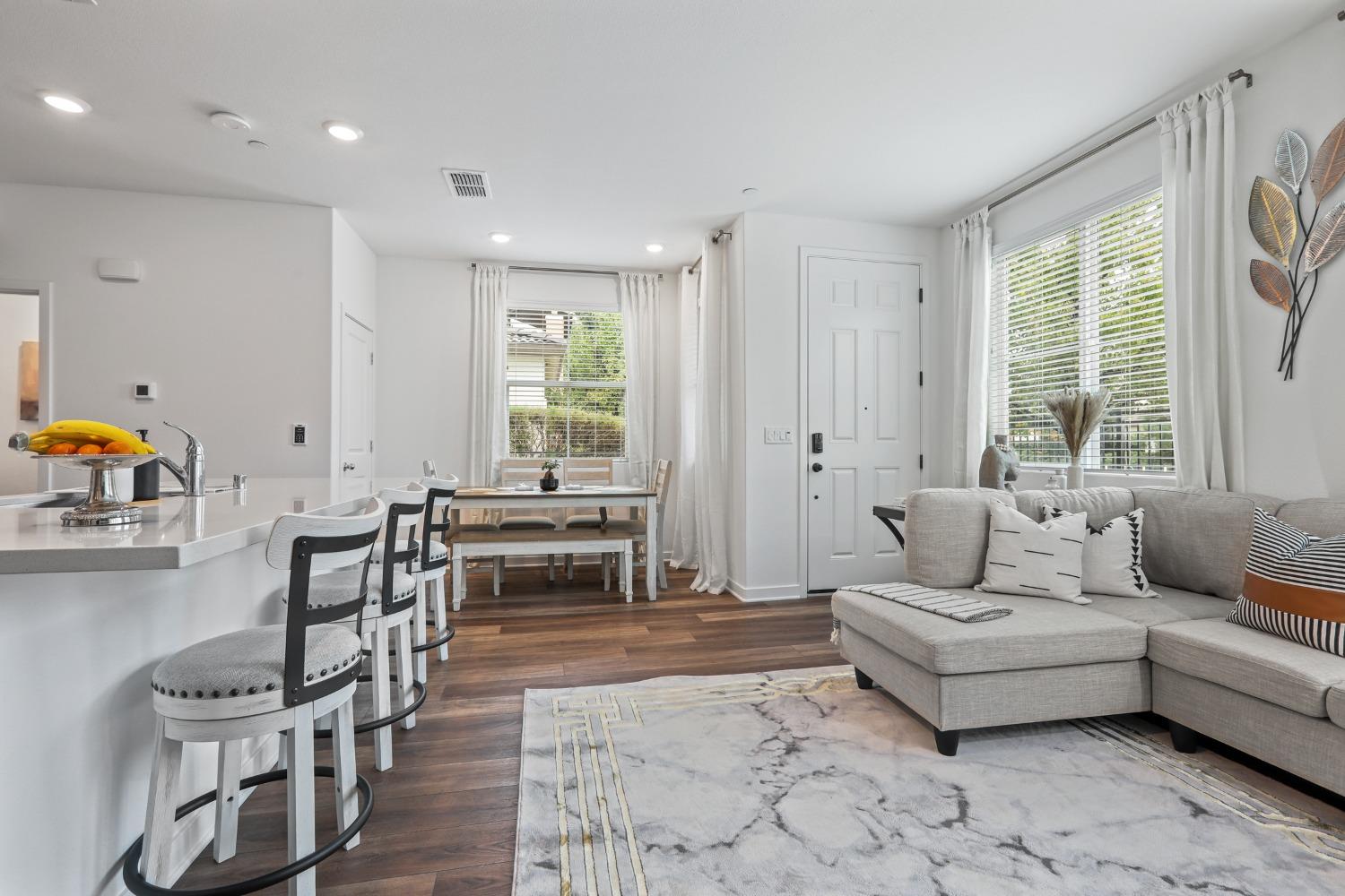 a living room with furniture and a table