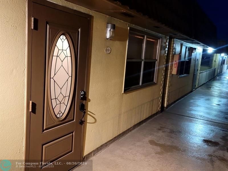 a view of a door with wooden door