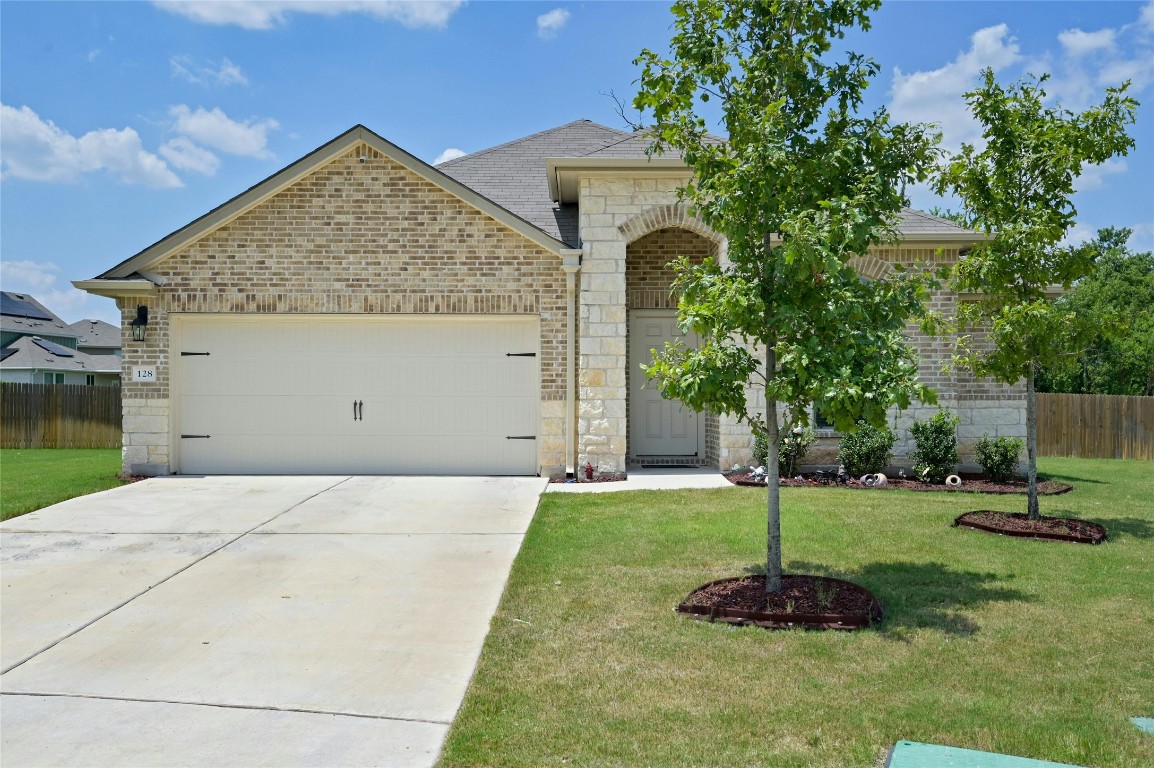 a front view of a house with a yard