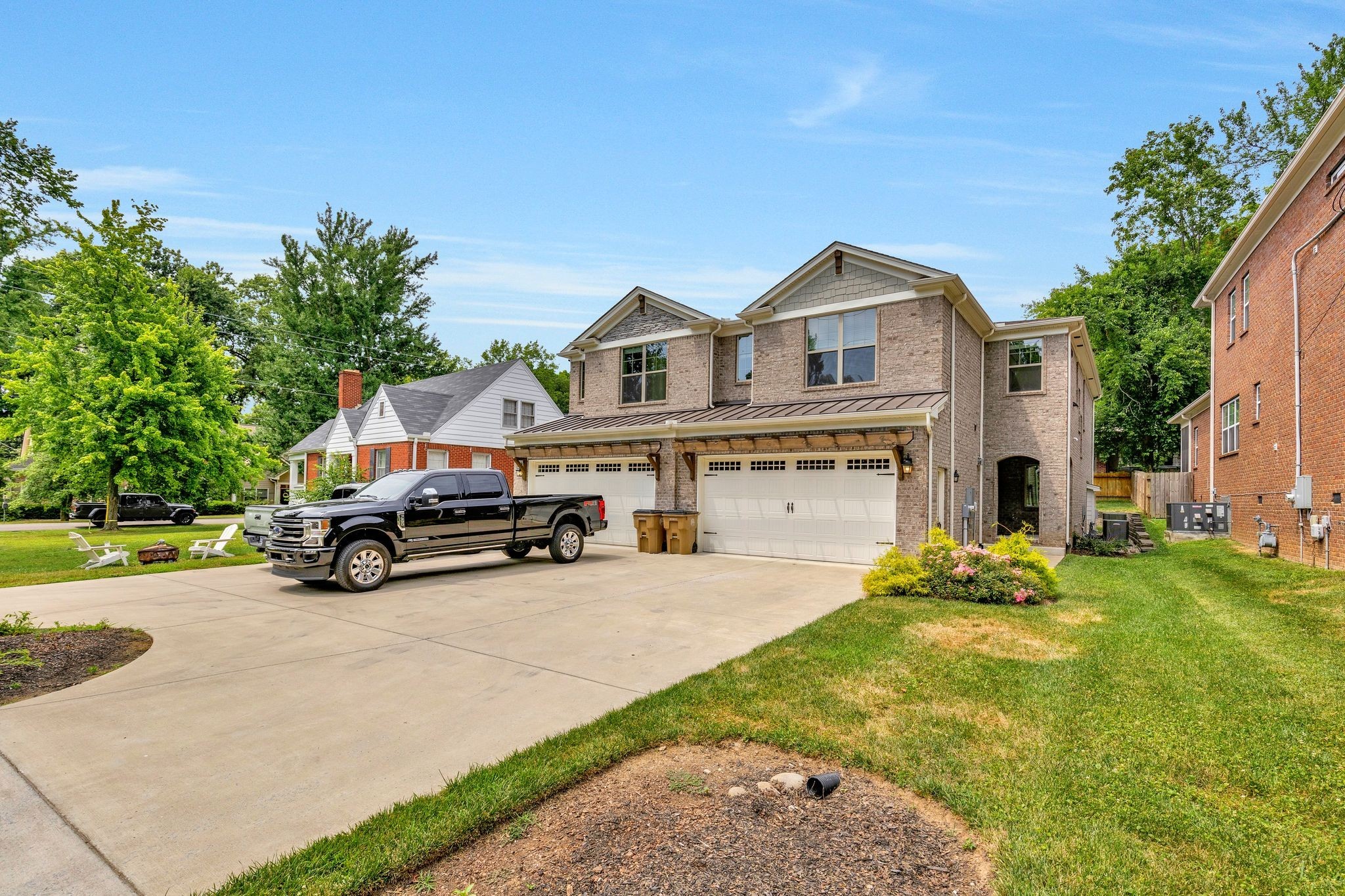 a view of a house with a yard and sitting area