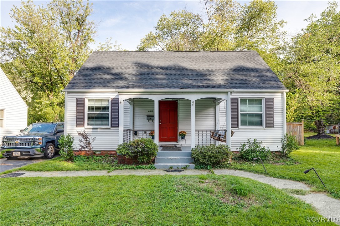 a front view of house with yard and green space