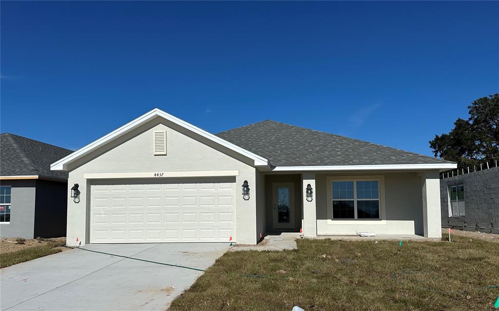 a front view of a house with a garage