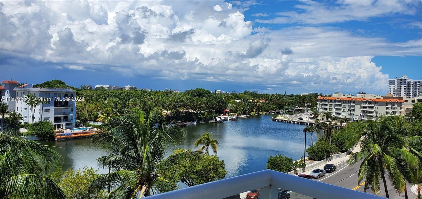 a view of residential house with outdoor space and lake