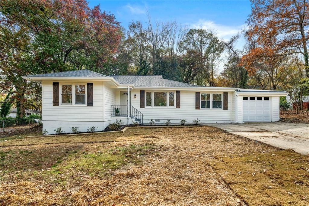 a house with trees in the background