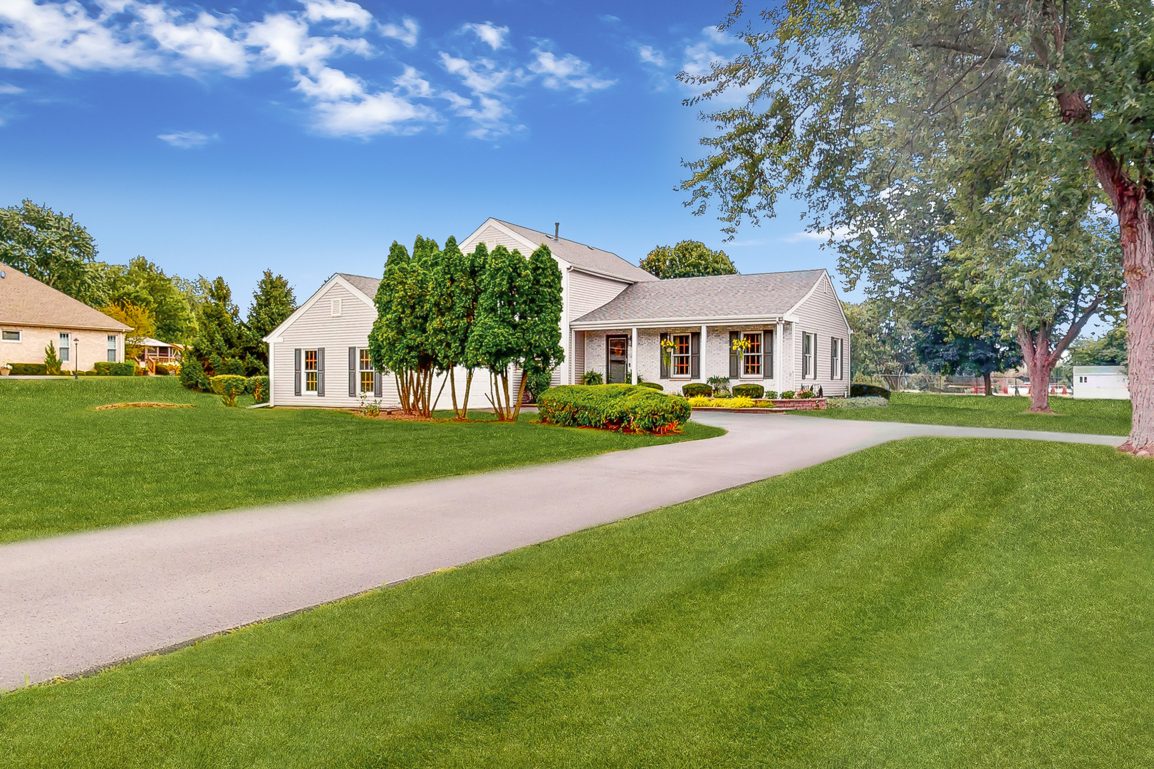 a front view of a house with a yard