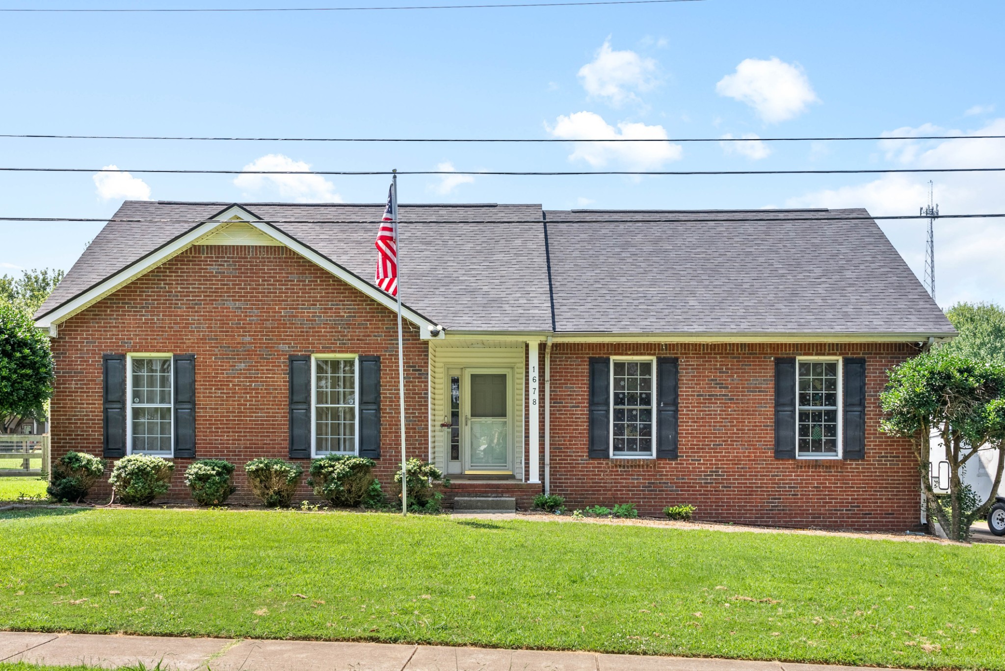 a front view of a house with a yard