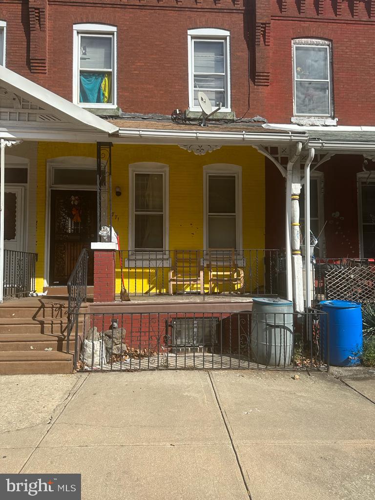 a view of a building with sitting area