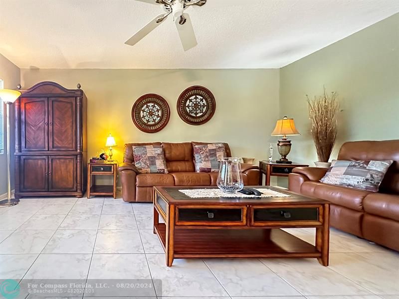 a living room with furniture and a table