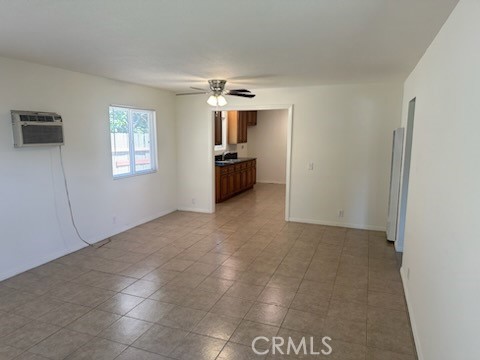 a view of a big room with windows and cabinet