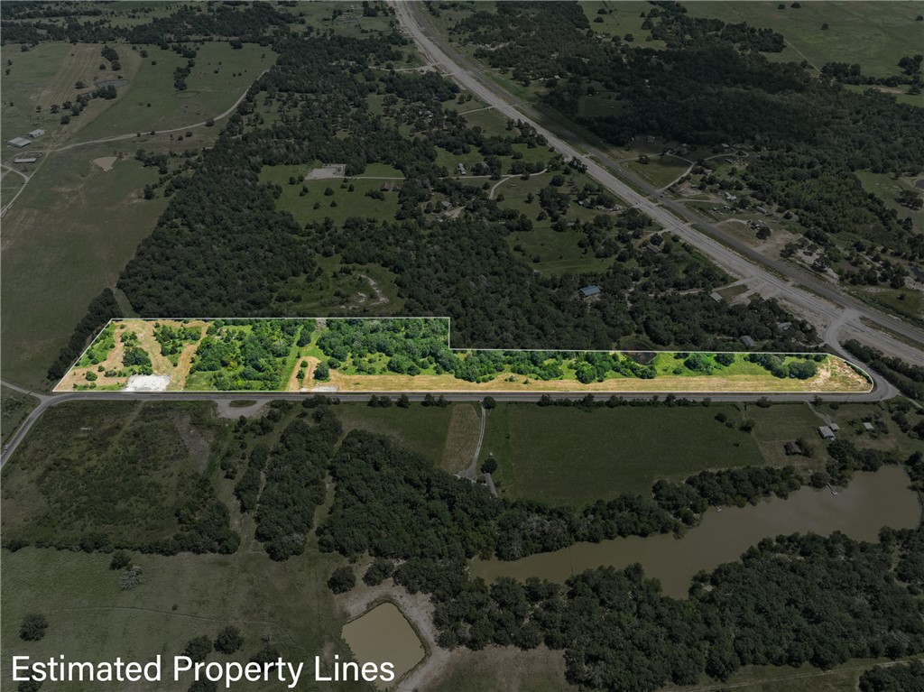 an aerial view of a residential houses with outdoor space