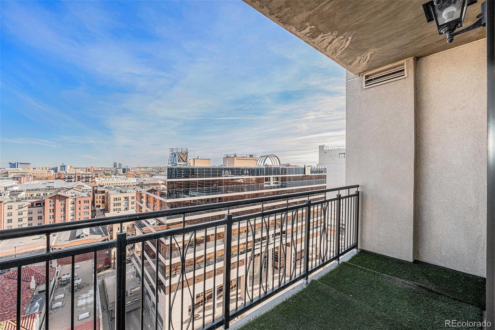 a view of a balcony with city view