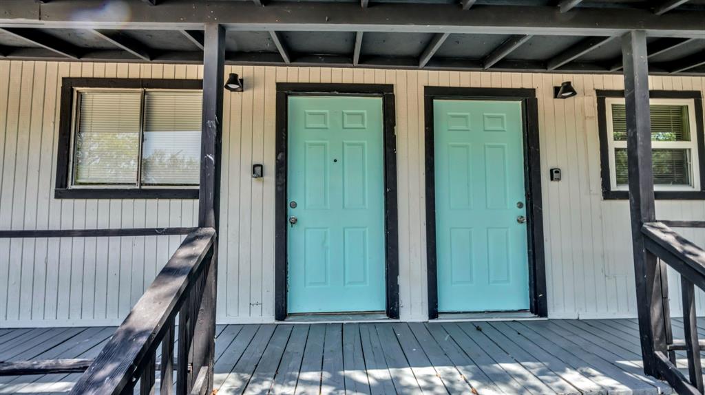 a view of a porch with wooden floor and stairs