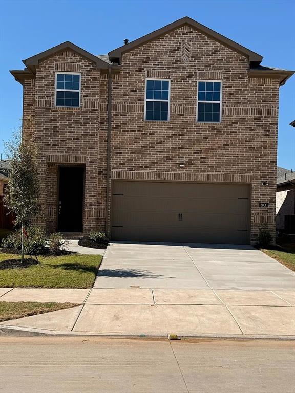 a front view of a house with yard