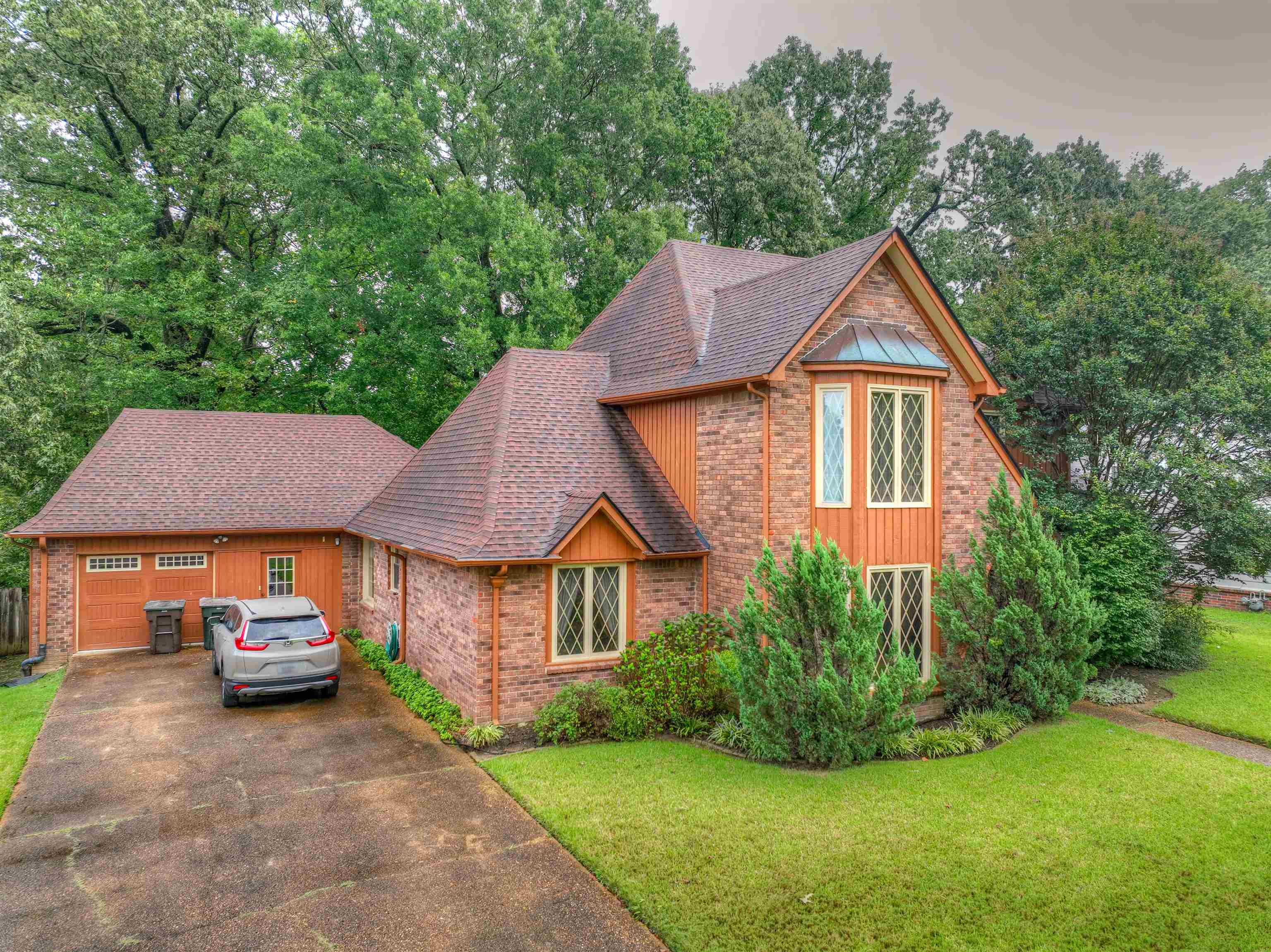 a front view of a house with garden