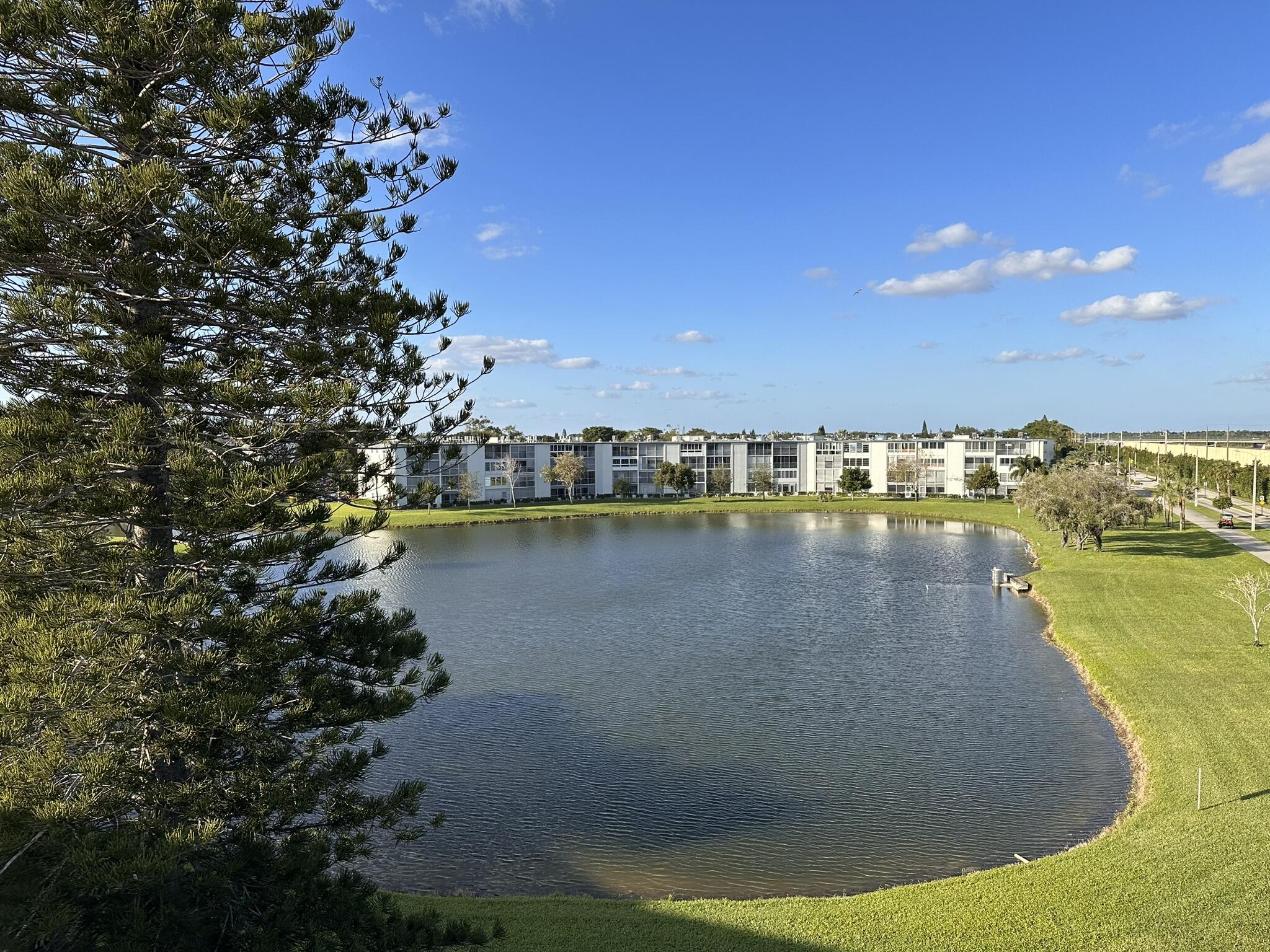 a view of a lake with houses in the back