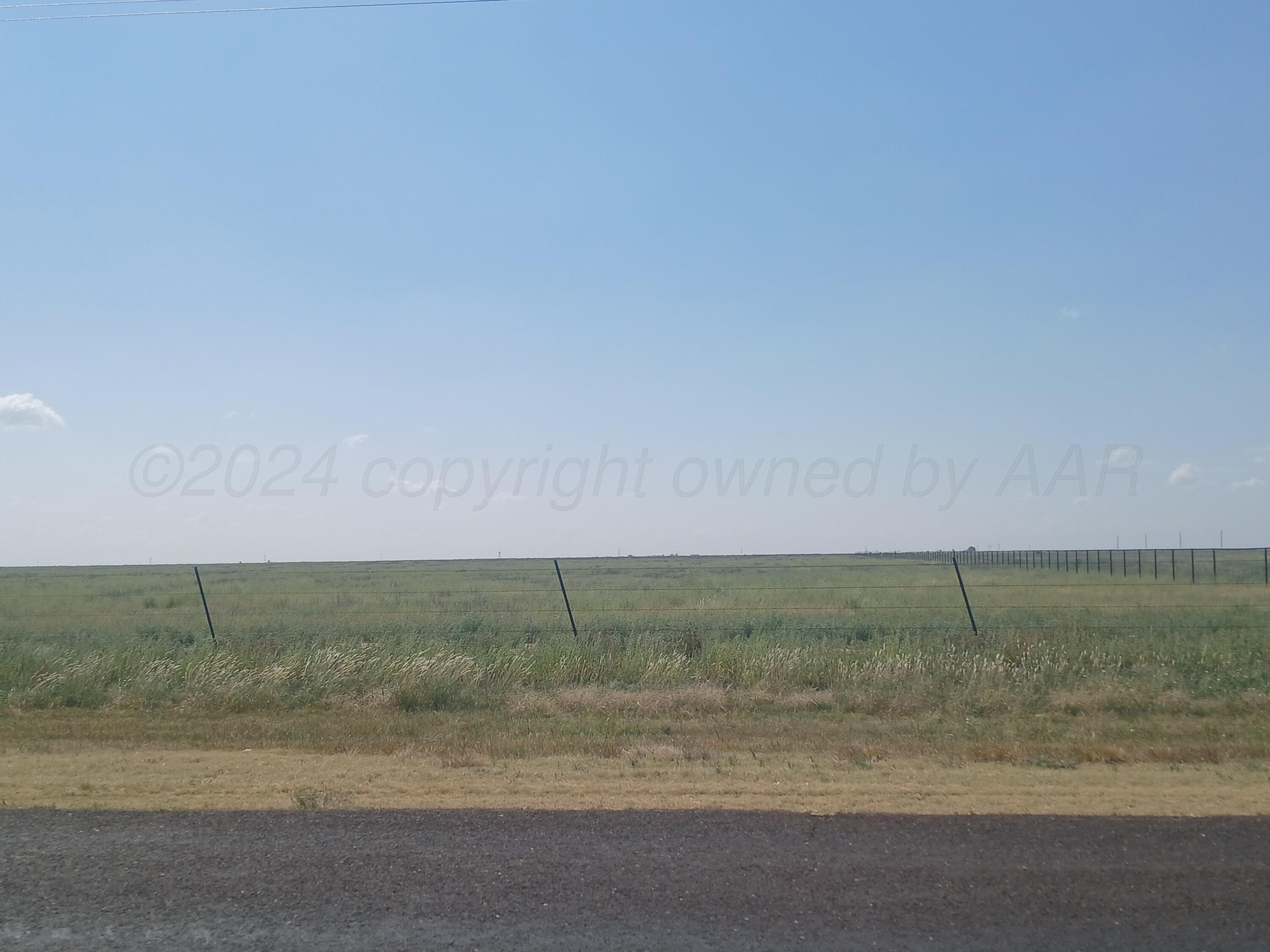 a view of a field with beach