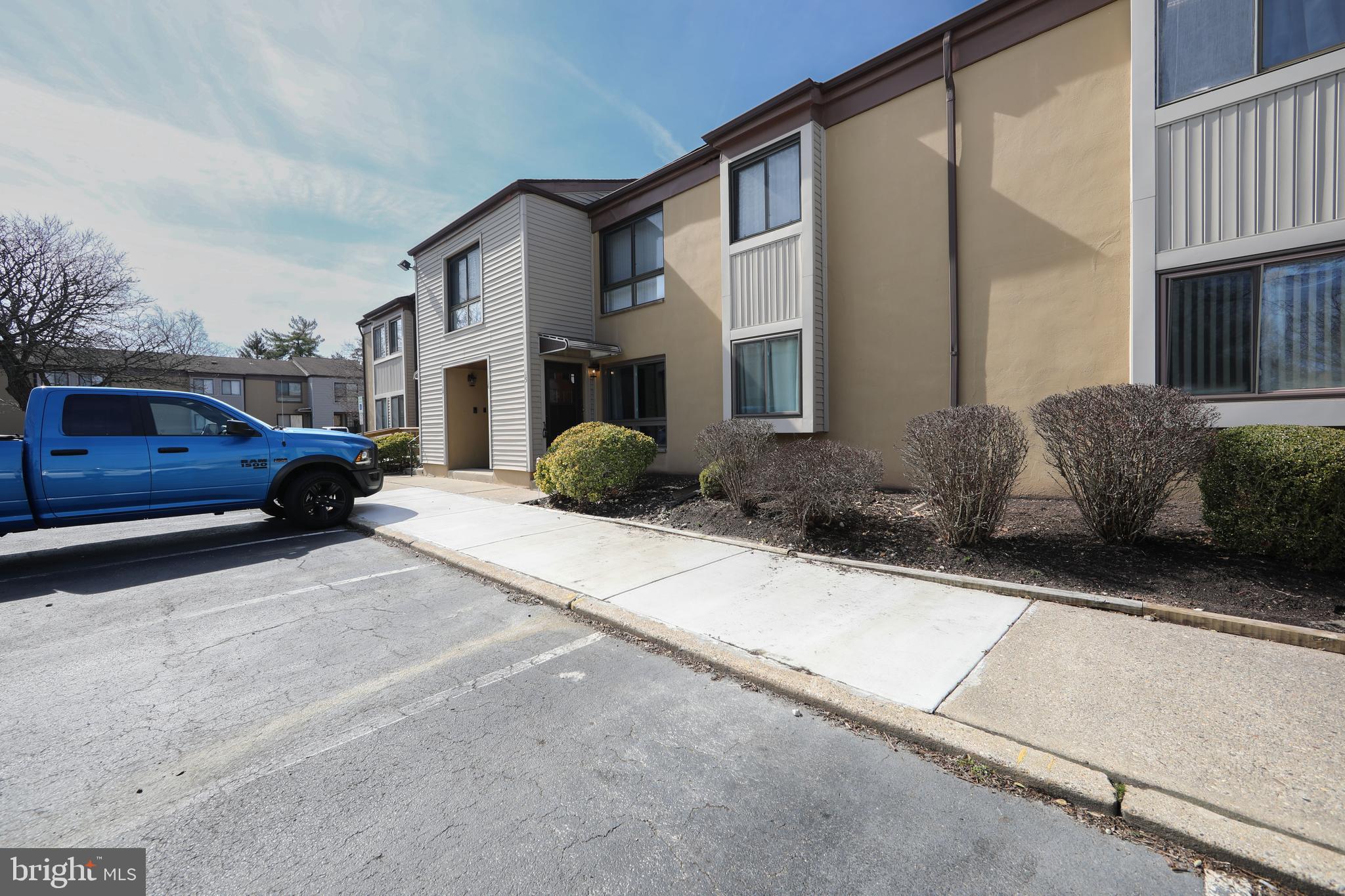 a view of a car park in front of house