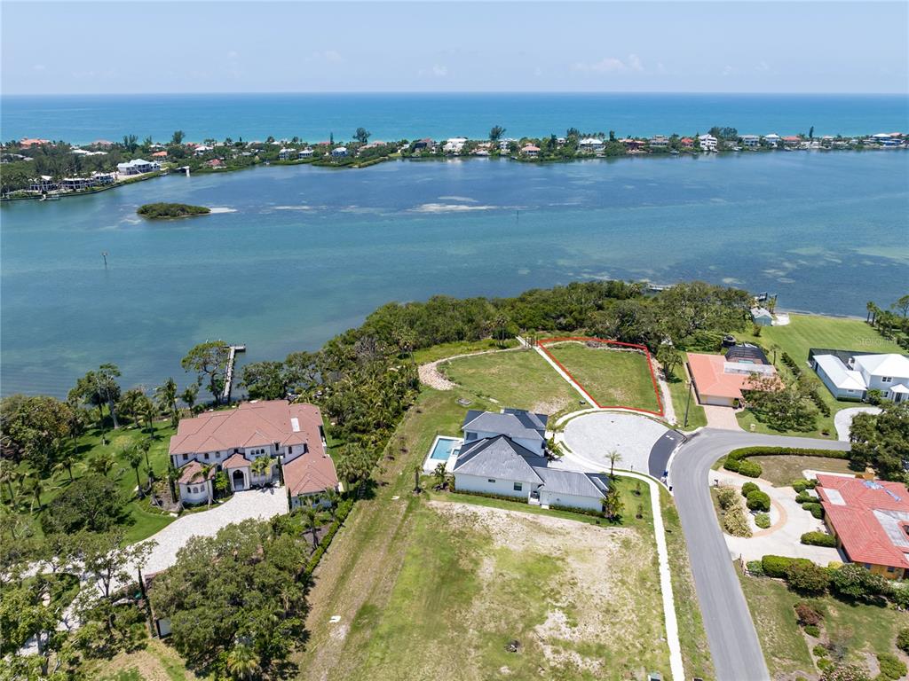 an aerial view of a house with a lake view