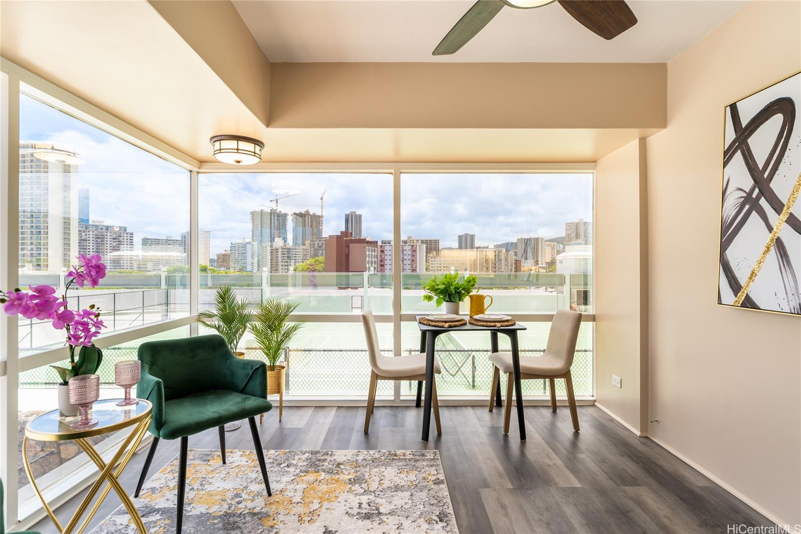 a view of a dining room with furniture window and wooden floor