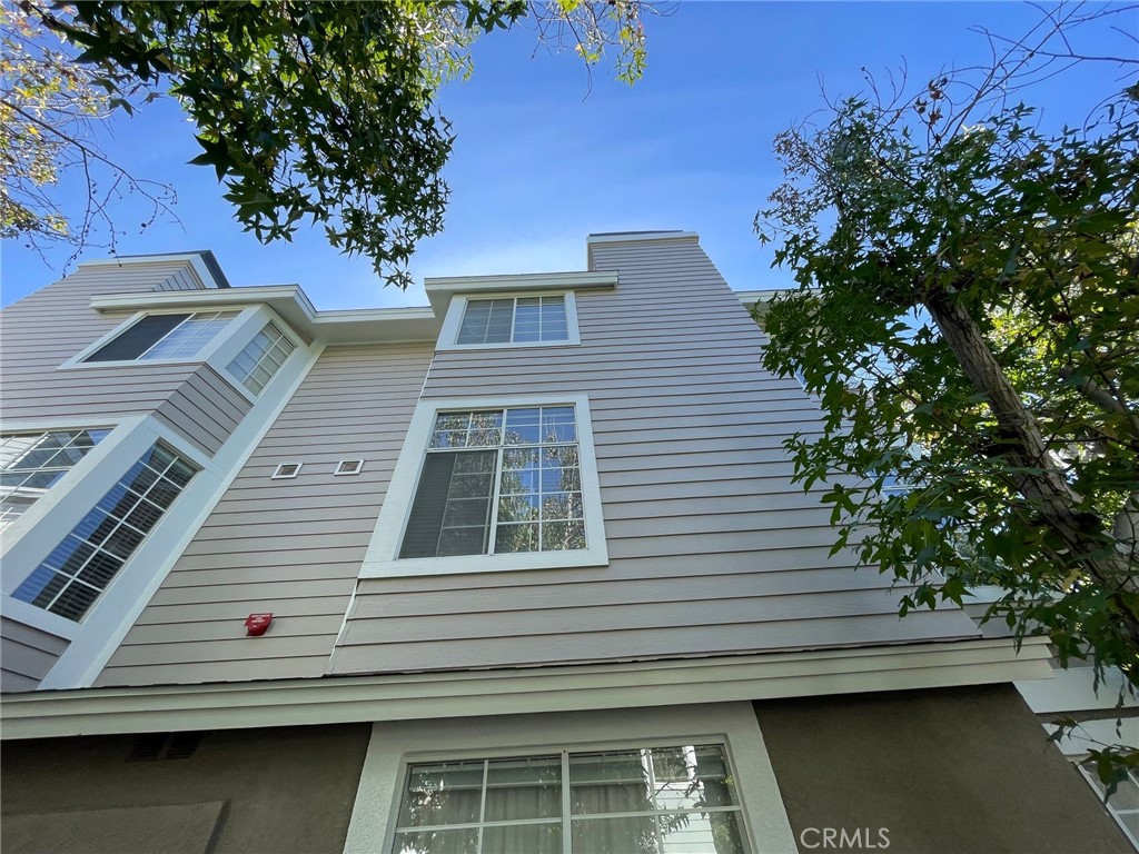 a view of a house with a tree