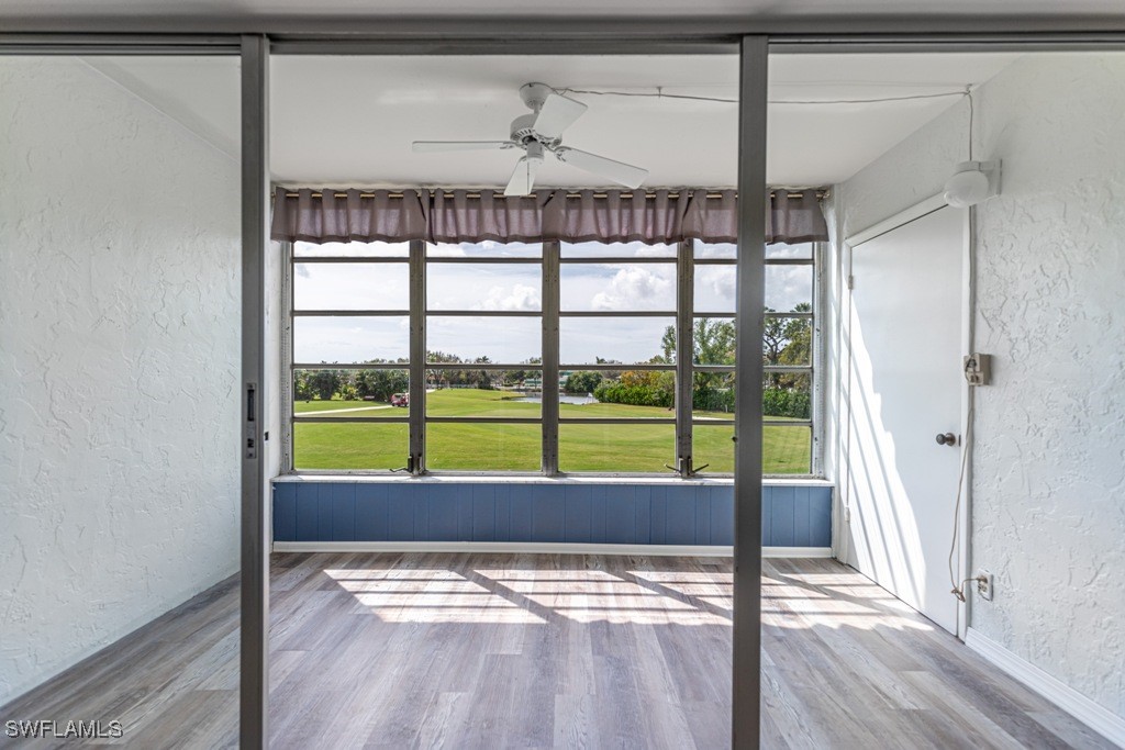 a room with a rug and a window