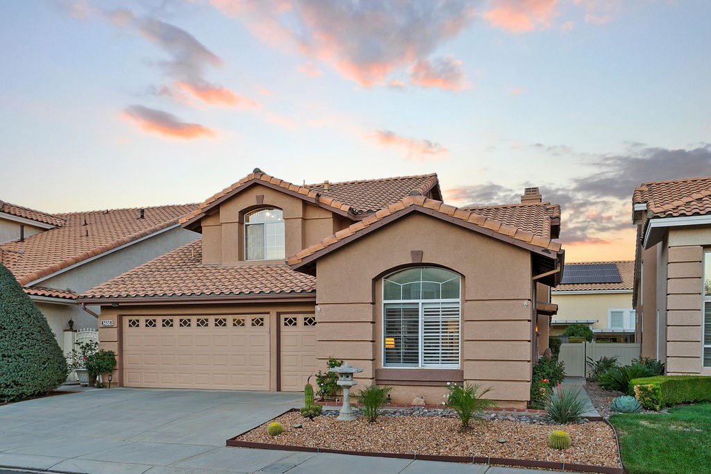 a front view of a house with garage