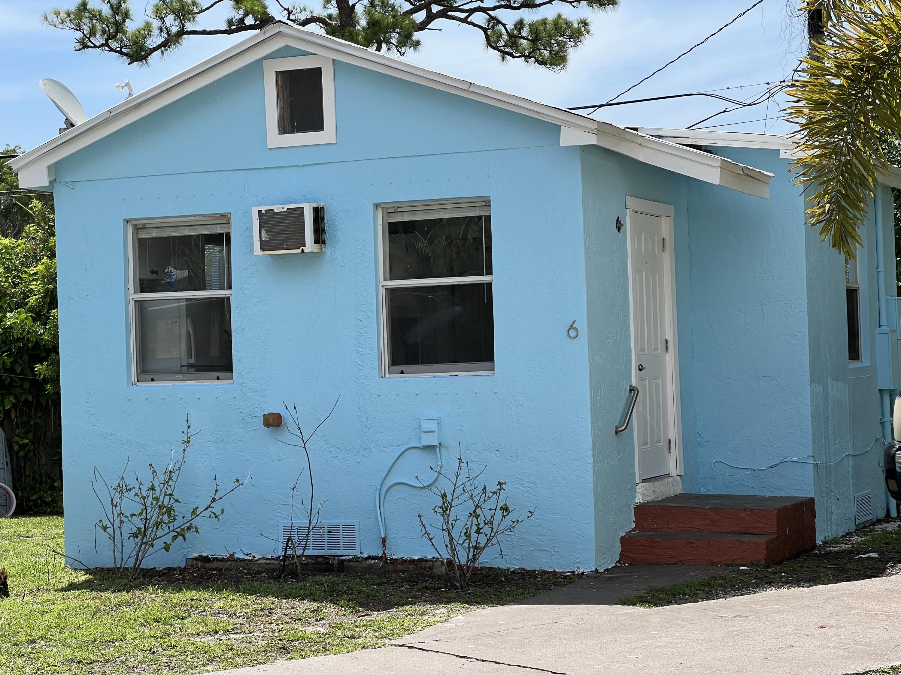 a house that has a potted plant on it